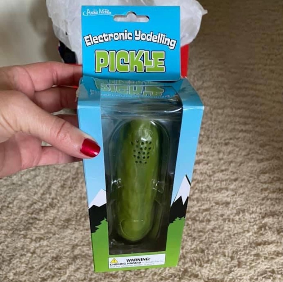 Can holding a box with yodeling pickle inside 