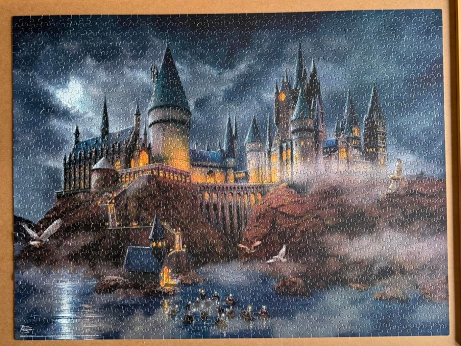 hogwarts puzzle put together on a tan board