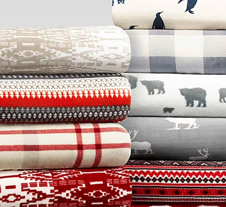 assorted eddie bauer throws folded and stacked