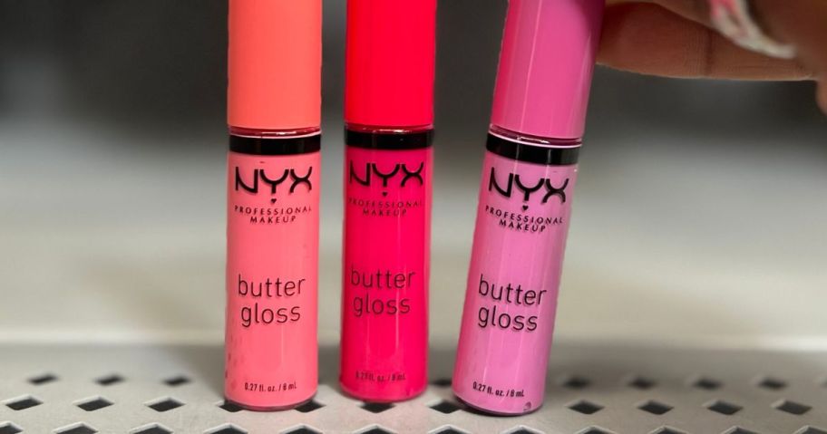 three NYX Butter Lip Glosses on shelf in store