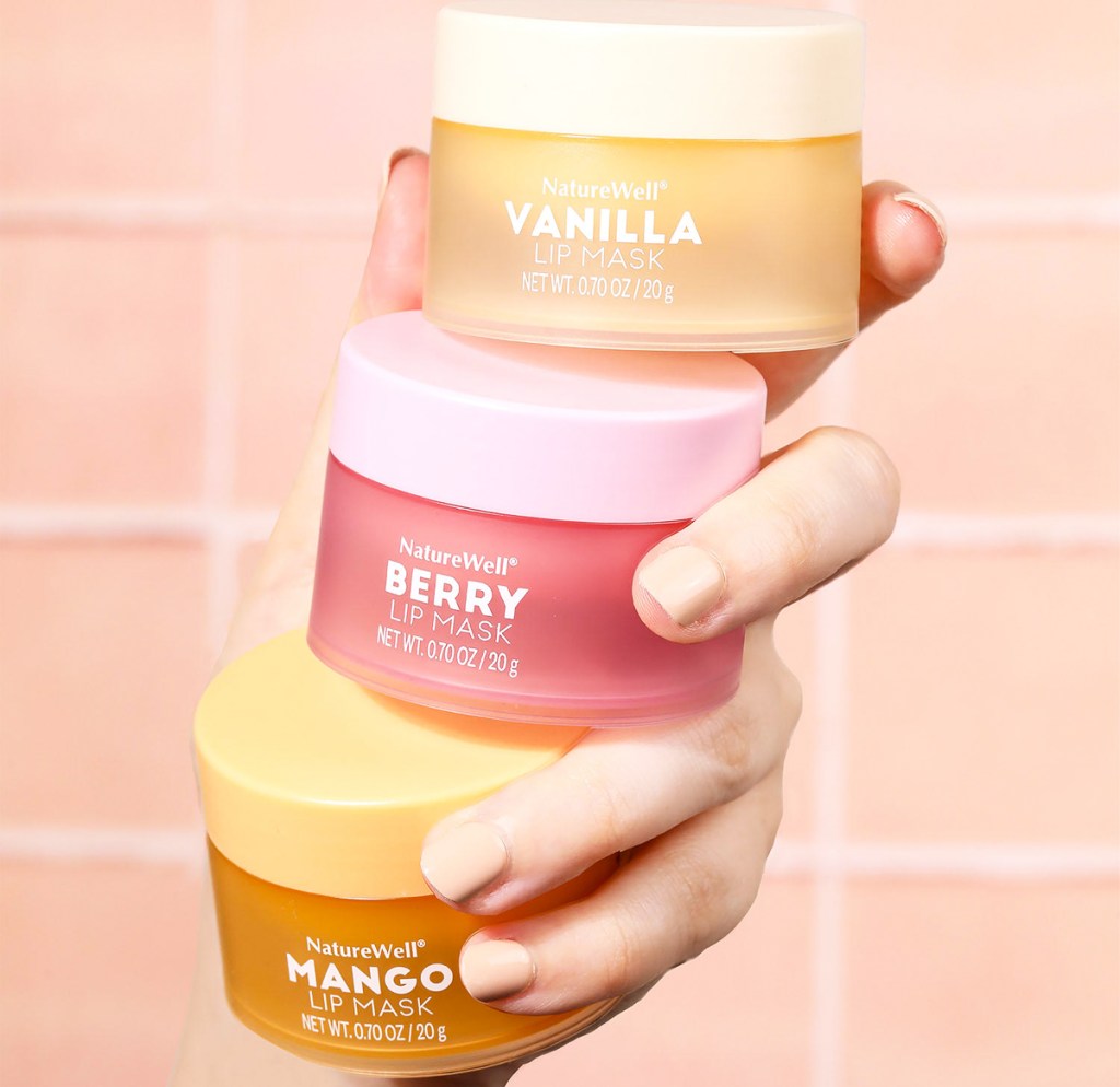 hand holding three jars of NatureWell Hydrating Lip Masks