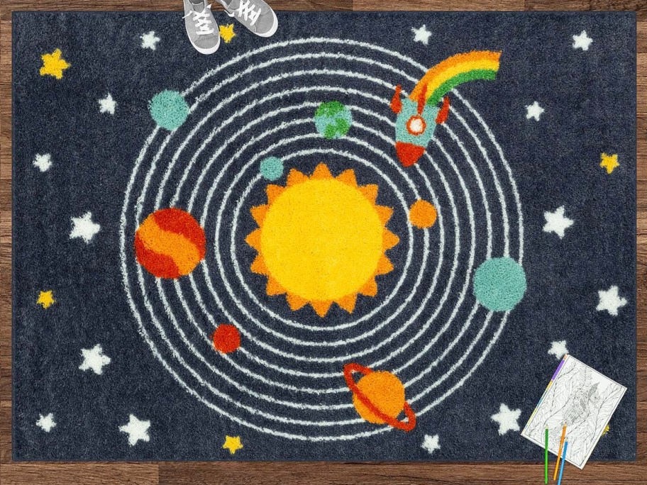 navy blue solar system print area rug