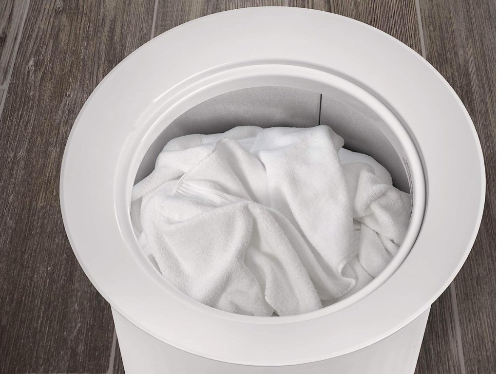 white towel warmer with towel displayed inside of it