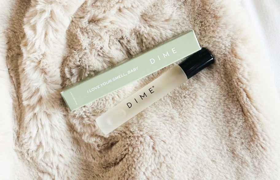 dime beauty fragrance on blanket