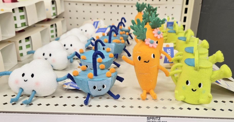 rows of felt figurines on store shelf