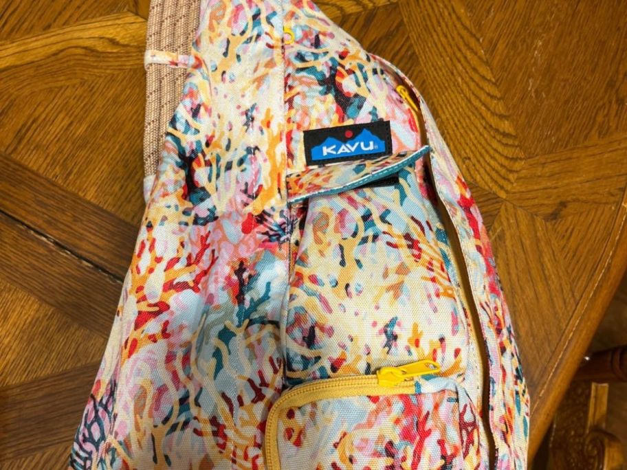 multicolored kavu bag on table