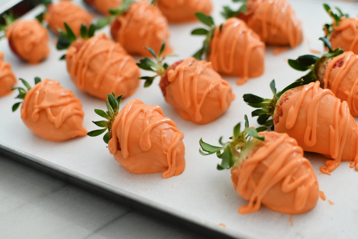 sheet pan tray with finished strawberry carrots for easter