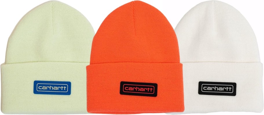 three Carhartt beanies in light green, orange, and white