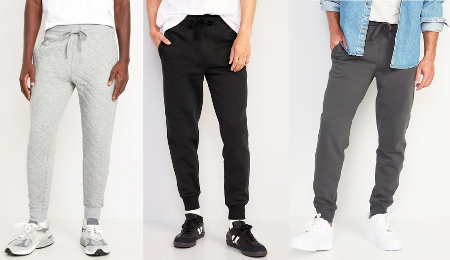 three men in light grey, black, and dark grey joggers