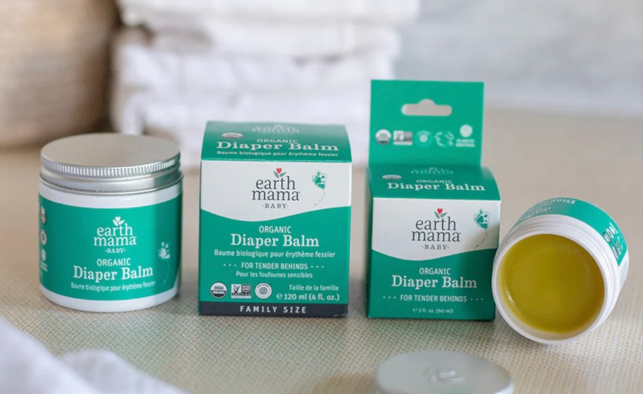 earth mama organic diaper balm boxes and tins on counter