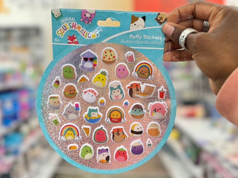 hand holding a pack of Squishmallows&trade; Puffy Stickers 