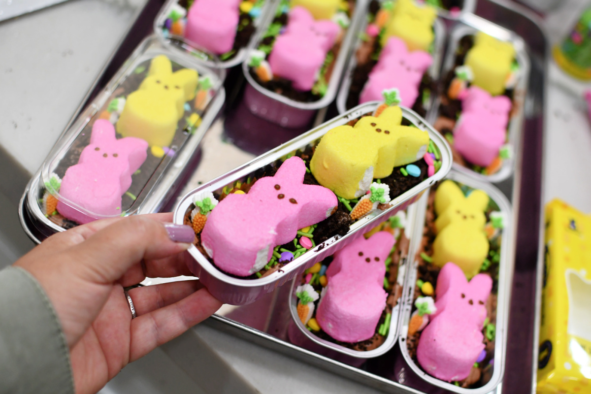 holding a mini dirt cake easter dessert