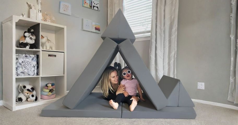 an adult and kid sitting on imaginarium kids play couch