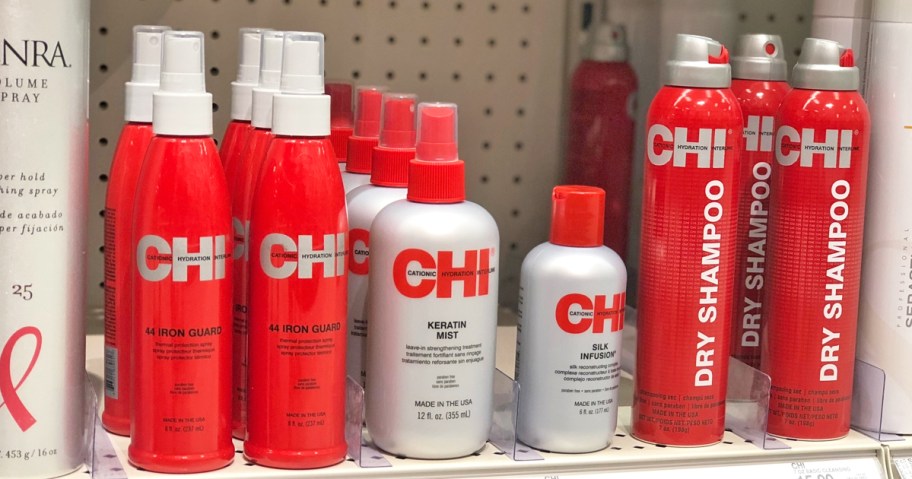 red and silver bottles of chi hair styling products on store shelf