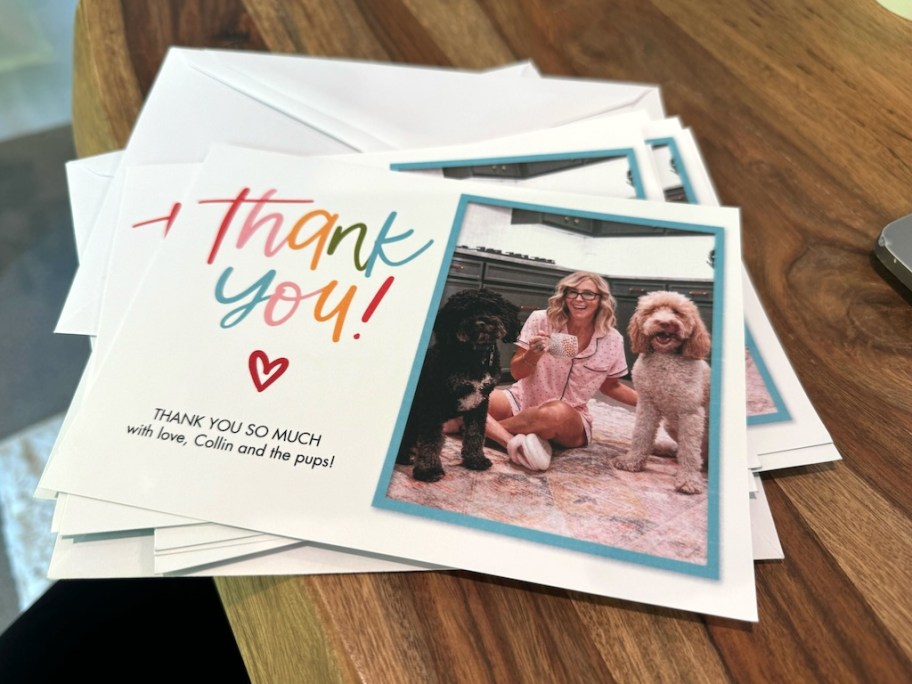 stack of thank you cards on a wood table