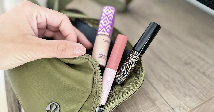 mini tarte cosmetics in green lululemon belt bag