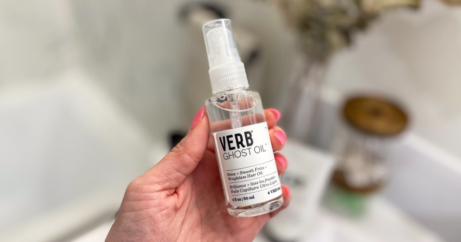 hand holding a bottle of Verb Ghost Oil