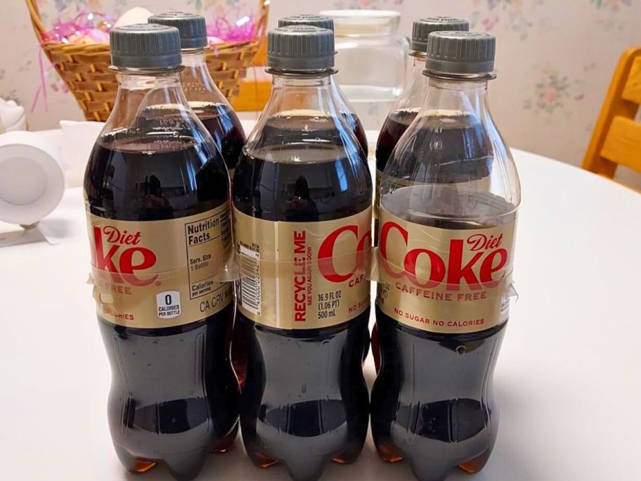 Caffeine Free Diet Coke 16.9oz 6-Pack on top of the table