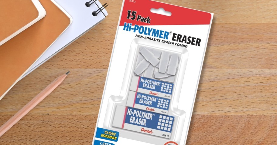 a pack of Pentel erasers in various sizes on a desk