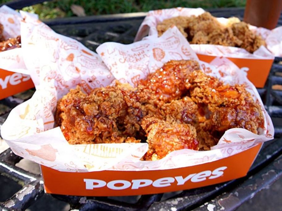 boneless wings in a paper Popeye's tray