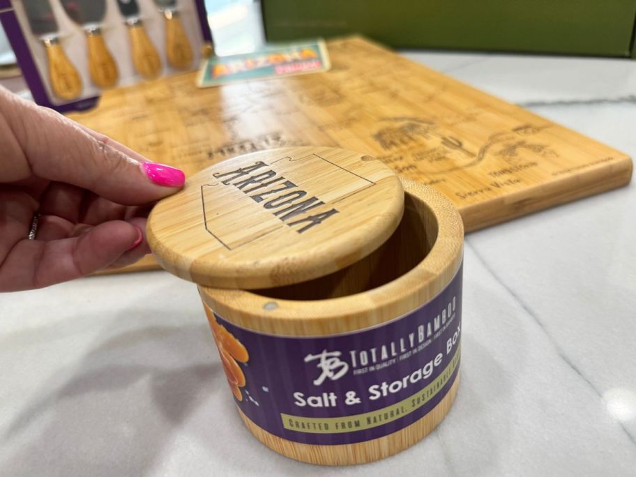 Close up view of a bamboo salt celler with a swivel top that says Arizona on it