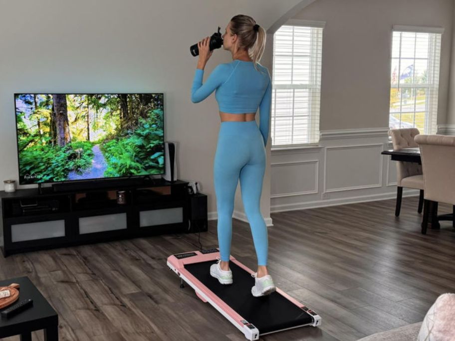 woman walking on walking pad