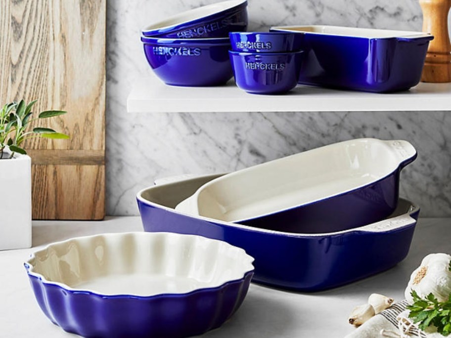 a set of blue and white ceramic bakeware dishes in a kitchen