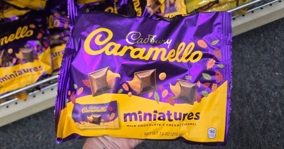 hand holding bag of Cadbury Carmello Miniatures