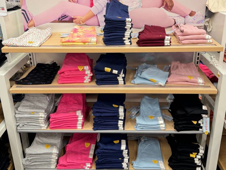 A rack of folded girlsCat & Jack leggings at Target