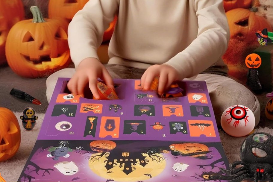 boys hands over halloween advent calendar