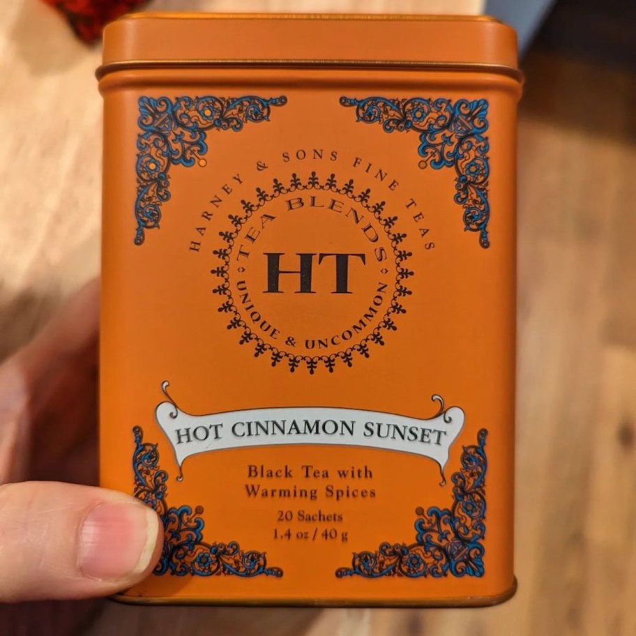 hand holding container of harney and sons tea