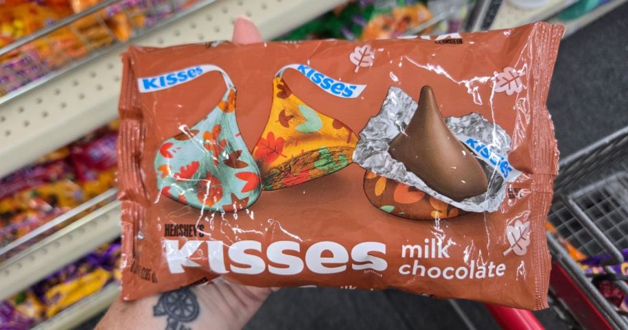 hand holding bag of Hershey's Kisses Fall Harvest&nbsp;