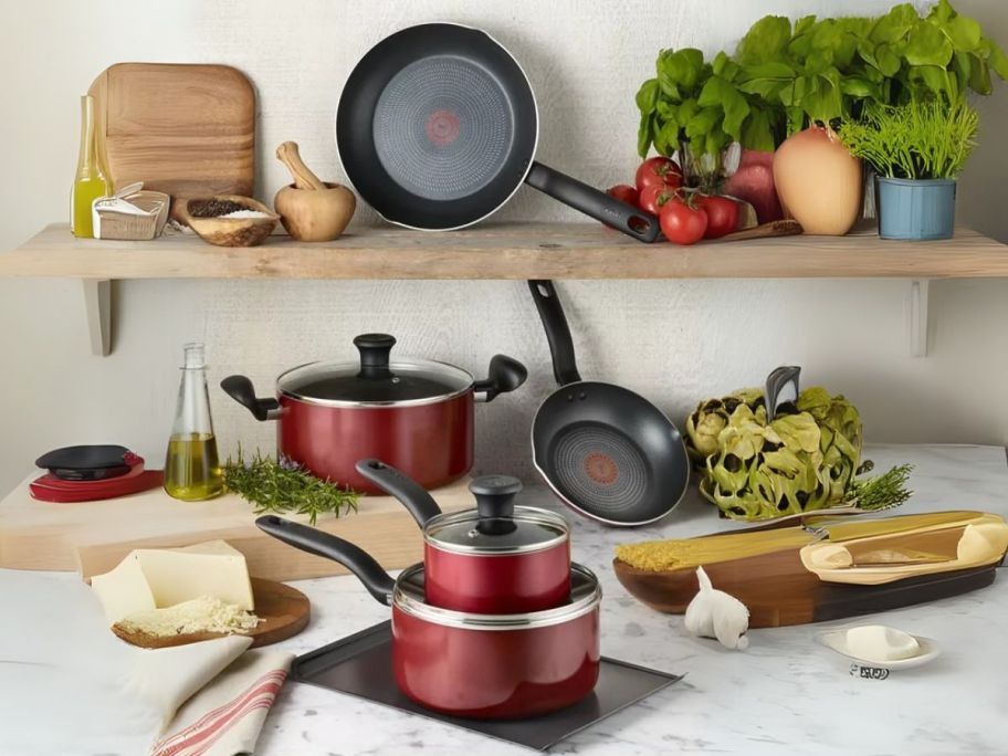 red T-Fal Culinaire Nonstick Aluminum Cookware Set in kitchen