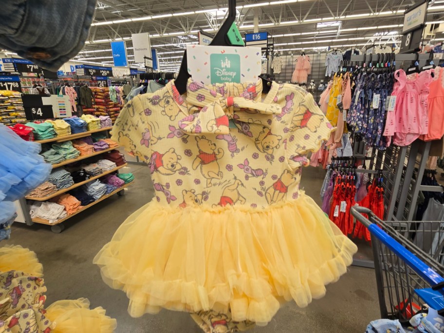 Hand holding Winnie the Pooh Baby Girl Tutu Set