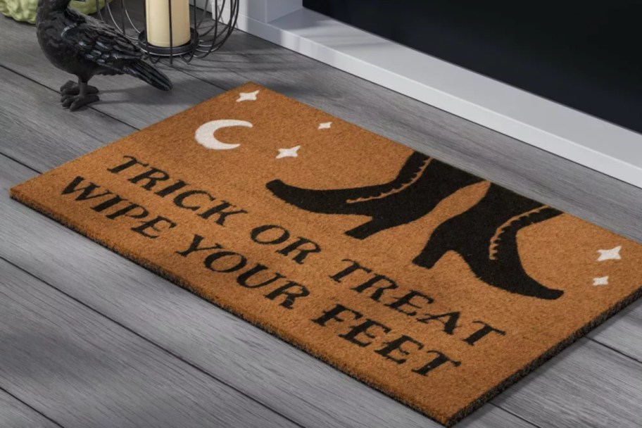 coir doormat with black witches feet