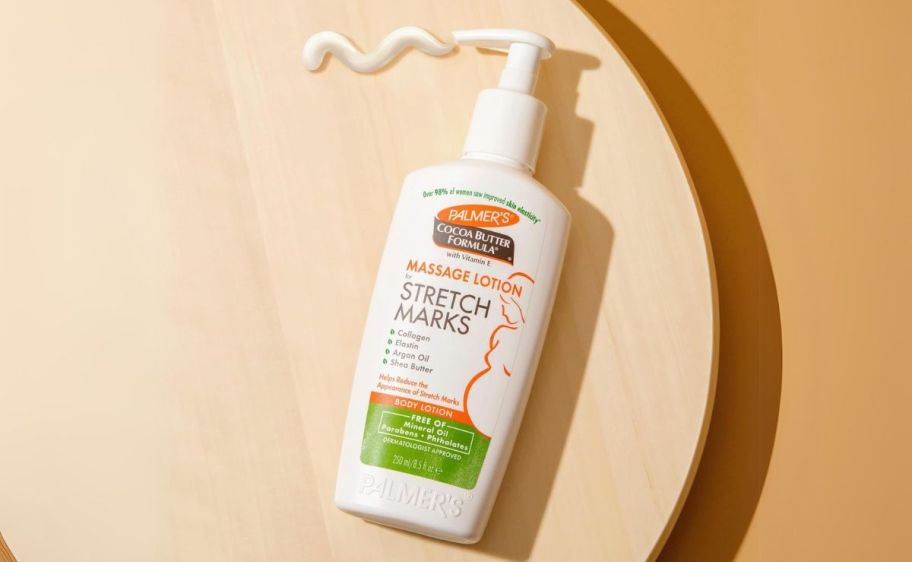 palmers lotion bottle on a wooden tabletop