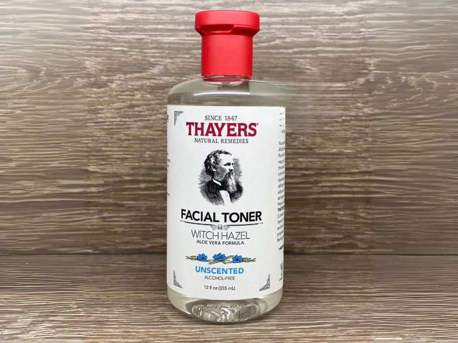 Thayers Witch Hazel Hydrating Unscented Facial Toner 12oz bottle on wooden shelf