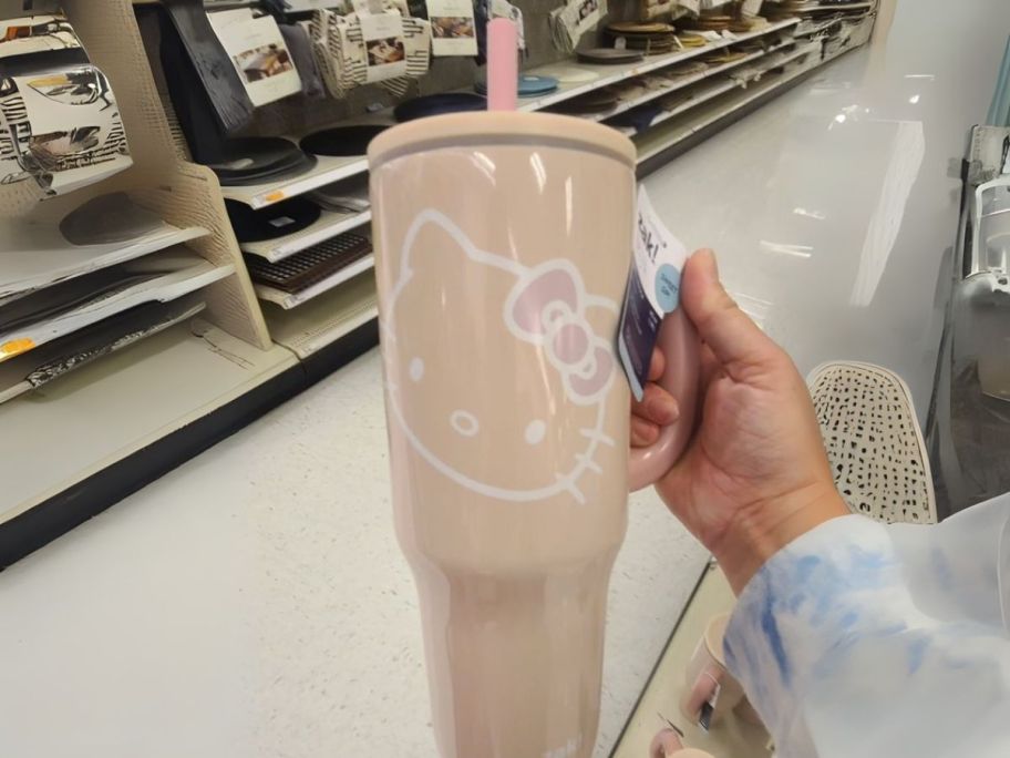 hello kitty Zak Designs 40oz Stainless Steel Vacuum Insulated Tumbler in hand in store