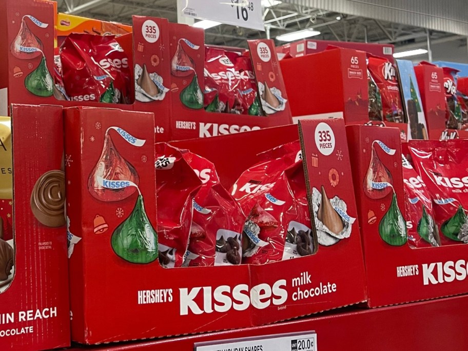 boxes of Hershey&rsquo;s Kisses Christmas Milk Chocolate Candy large bags on a Sam's club store shelf