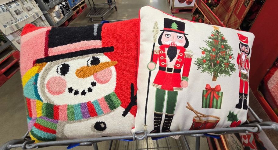 two Member's Mark Holiday Accent Pillows inside of a sams club shopping cart