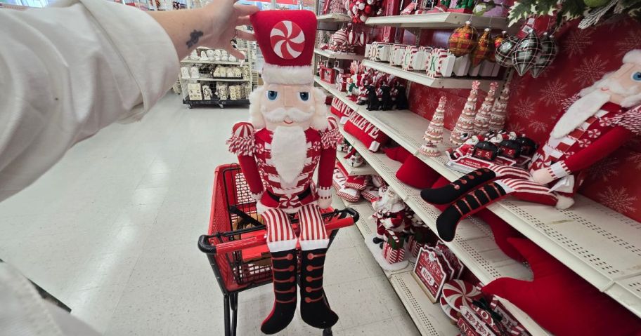 A large, plush, Christmas Nutcracker decoration