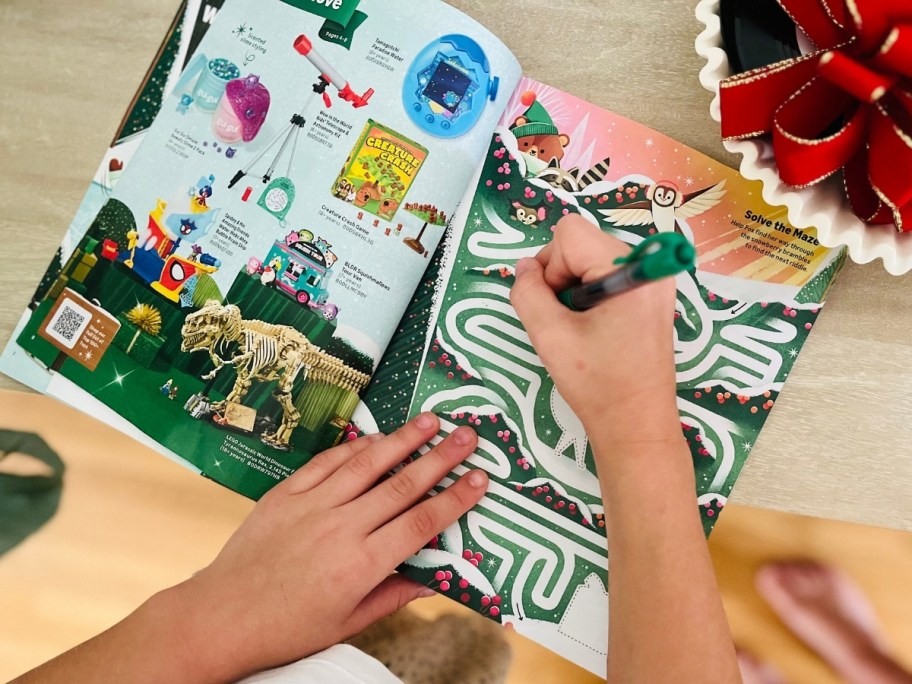 someone completing a puzzle activity in the amazon toy catalog