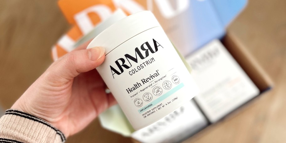 hand holding jar of armra health revival 