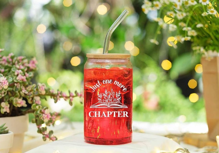 just one more chapter glass tumbler with red juice
