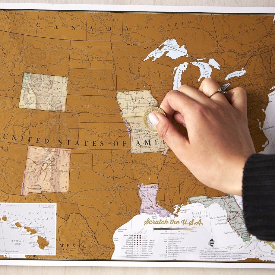 hand scratching off map