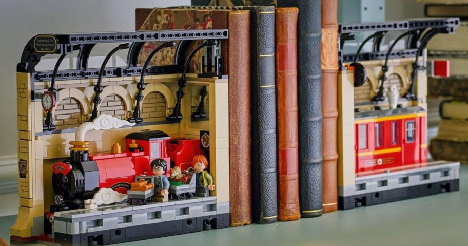 a LEGO Harry Potter Book Nook: Hogwarts Express set on a shelf with books between each piece