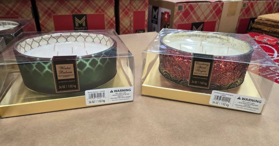 2 large 5-wick candles displayed in a store