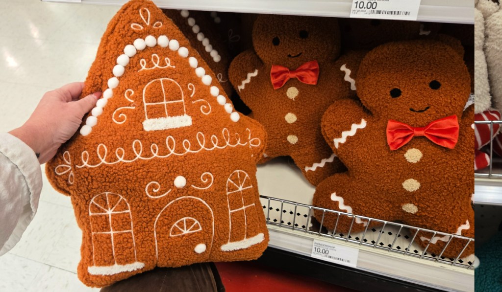 Gingerbread house and gingerbread man throw pillows inside target store