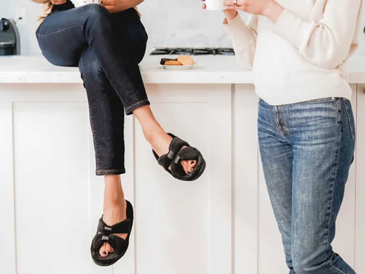 woman sitting on counter cross legged wearing Women&rsquo;s Microterry with Satin X-Slide Slippers