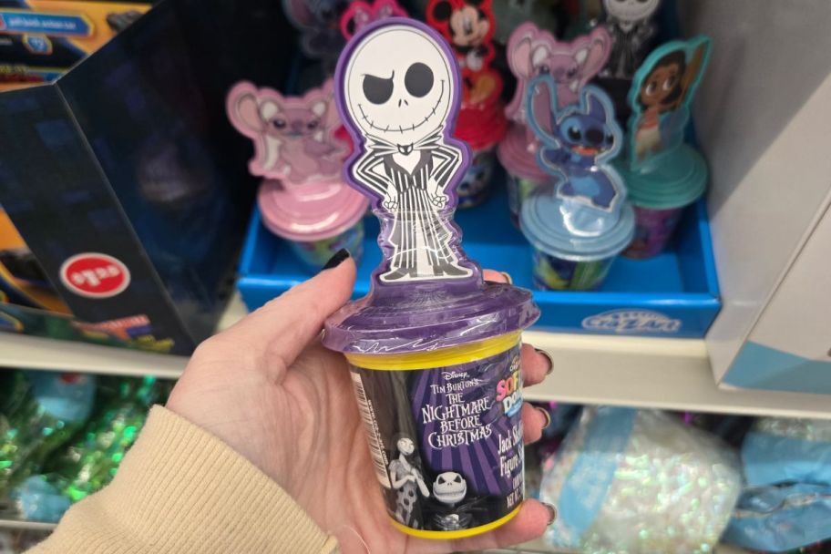 a womans hand holding a softee dough stamper